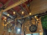 a chandelier in the middle of a restaurant with lots of lights