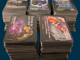a lot of books that are stacked on top of each other