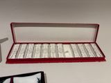 a red box with a silver ring inside of it