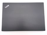 a laptop that is sitting on a white surface