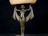 an image of a statue of a woman holding a bowl on her head