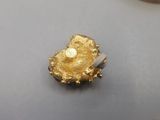 a gold ring that has been placed on top of a table