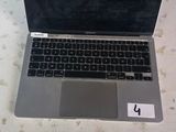 a laptop computer sitting on a table with a mouse on it