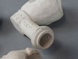 three pieces of pottery sitting on a table
