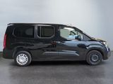 a picture of a black van parked in a garage