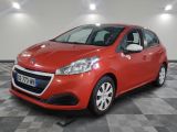 a red car is parked in a room with a checkered floor