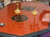 a table that has candles on it in the middle of the room
