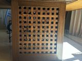 a wooden table with a lattice design on top of it