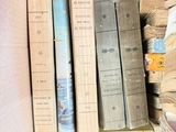 a box full of books sitting on top of a table