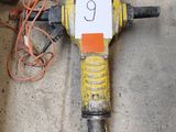 a drill that is laying on the ground with a number 9 on it