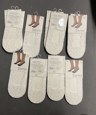 six pairs of women ' s white socks with white lace on them
