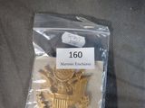an image of a gold seal on top of a plastic bag