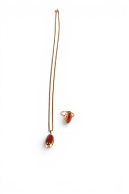 an image of a pair of earrings and a necklace on a white background