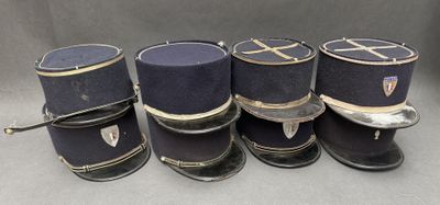 six hats are lined up on top of each other on a table