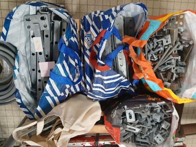 a pile of assorted items sitting on a shelf