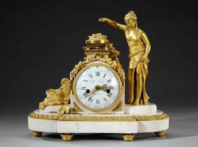Pendule en bronze doré ciselé et marbre blanc, représentant …