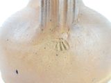 a vase that has a fork sticking out of it