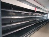 many empty shelves in a store that are empty