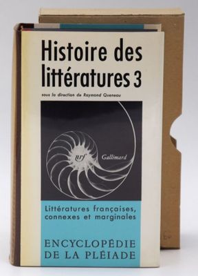 an old book in a cardboard box on a white surface