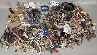 a pile of assorted jewelry sitting on a table