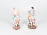 pair of porcelain figurines of a man and a woman