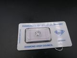 a close up of a diamond on a card on a table
