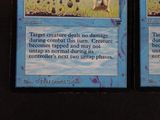 two cards on the table that have a picture of a dog