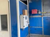a large blue and white machine in a building