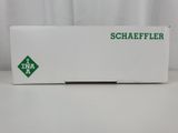 a white box with a green logo on it sitting on a table