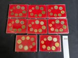several red and gold coins on a black surface with a price tag