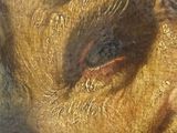 a close up of a painting of a man ' s face