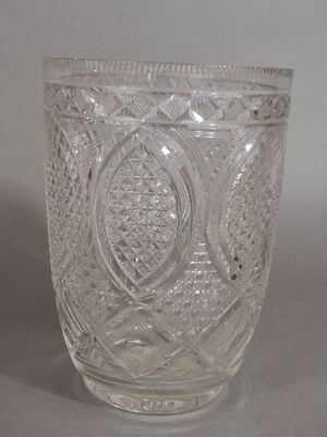 a glass cup that is sitting on a table