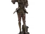 bronze statue of a man with a dog on a wooden base