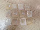 a lot of stamps that are on a wooden table
