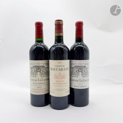 trois bouteilles de vin posées l'une à côté de l'autre sur une table