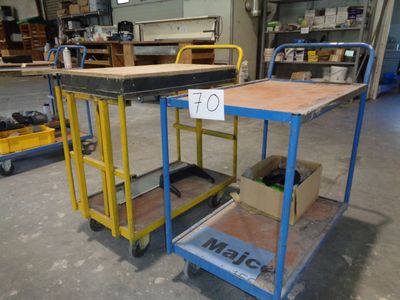 two carts that are sitting in a warehouse