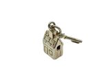 an image of a house key with a keychain attached to it