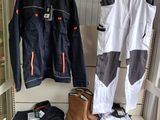 many pairs of shoes and jackets on a shelf