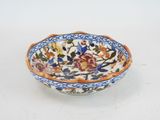 an image of a small bowl with a floral design on it