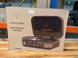 a cardboard box with a picture of a record player inside of it
