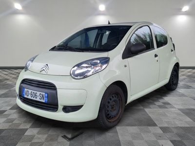 a picture of a small white car on a checkered floor