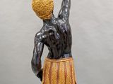 an image of a statue of a man holding a basketball ball