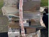 a large stack of boxes sitting on top of a pallet