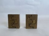 pair of brass plated bookends with the letter s on each side