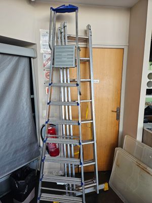 a ladder that is leaning against a wall in a room