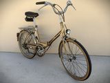 a bike that is parked against a wall near a wall