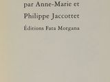 an old book with a black and white image of a cat