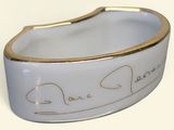 a picture of a white and gold bracelet with two hearts on it