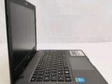 a black laptop computer sitting on a white table