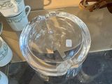 a glass table with cups and glasses on it